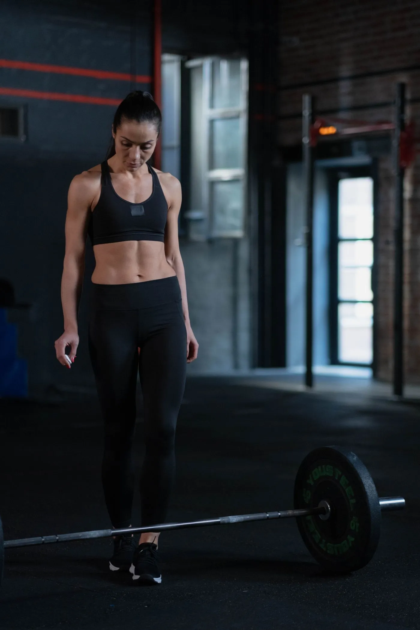 An athlete preparing for a barbell session